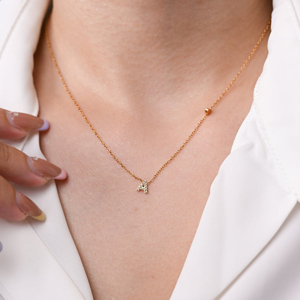GOLD DEMURE LETTER NECKLACE